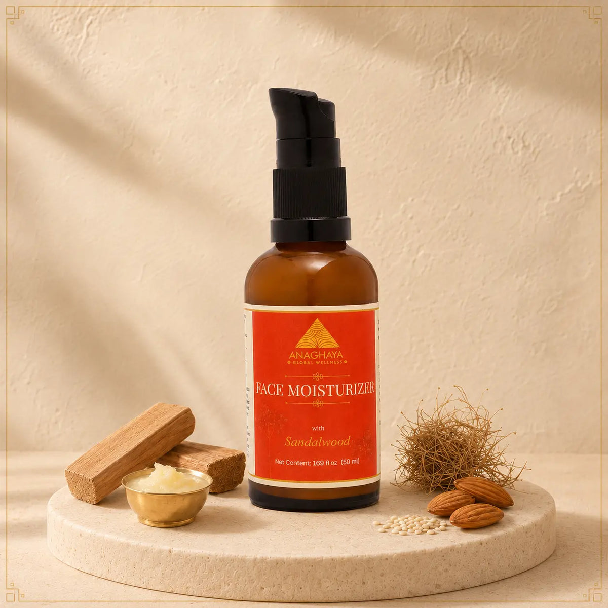 An amber glass face moisturizer bottle with a black pump and a red-orange label reading 'AMHARAWA NATURAL face moisturizer with Sandalwood' is displayed on a round stone pedestal with small props including a gold bowl, wooden pieces, and almonds against a textured beige background.