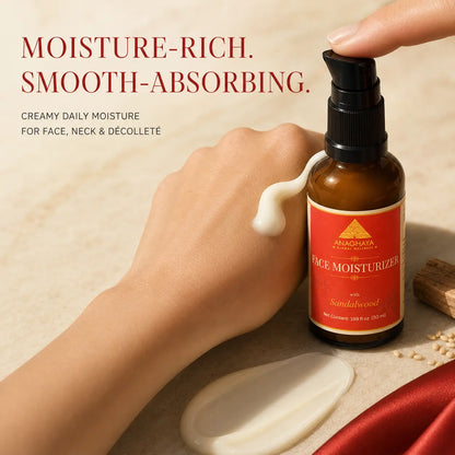 A hand holds a pump bottle of Alimozhaya Face Moisturizer next to a hand with cream smeared across it, on a beige textured surface with product text overlay.