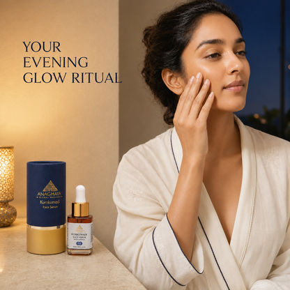 A woman in a cream robe applies a skincare serum to her face beside two Anachasa products: a dark blue and gold Kumbhamsa tube and a small amber dropper bottle. Text on the left reads 'YOUR EVENING GLOW RITUAL'.