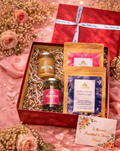 Load image into Gallery viewer, Luxury Mother’s Day gift hamper by Anaghaya featuring A2 Gir Cow Ghee, gulkand, Kashmiri kahwa tea, and spice tea in a premium red gift box.